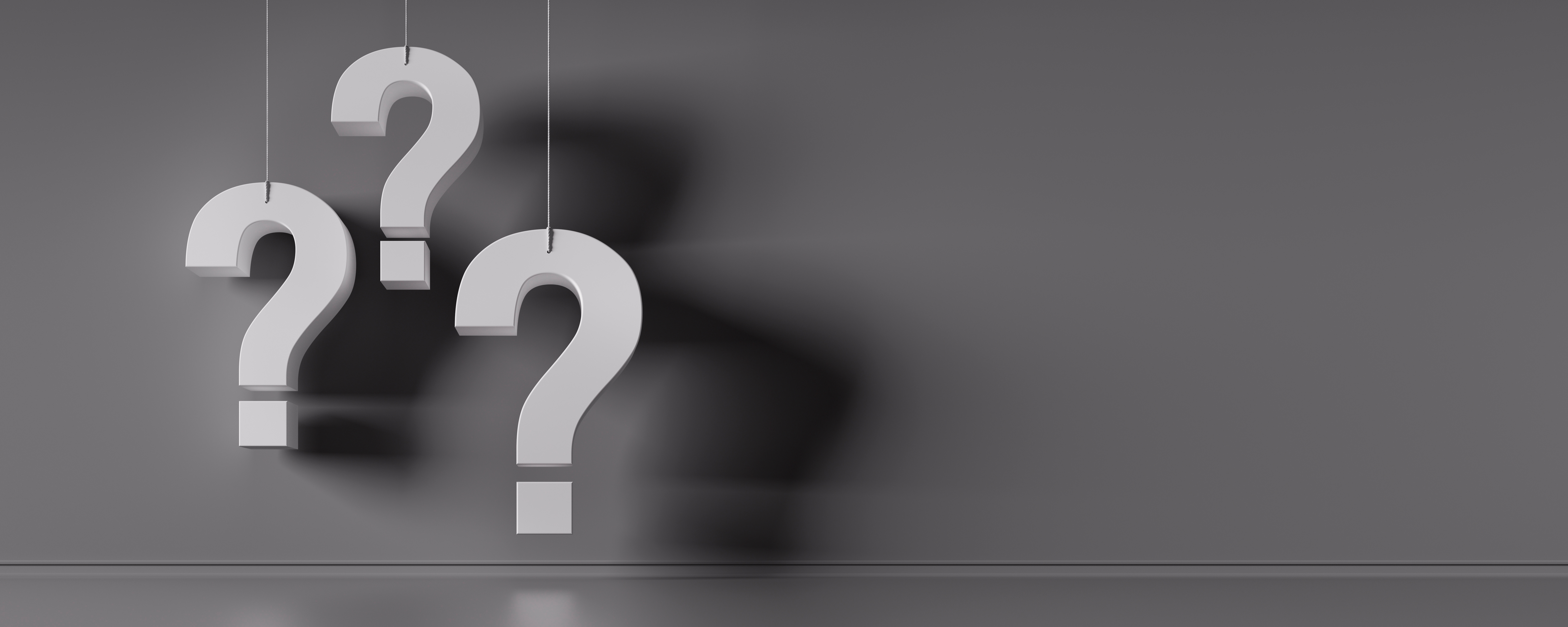3 white question marks hanging in front of a black background for header image on conveyancer FAQ blog 